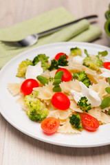 Farfalle pasta with broccoli and cherry tomatoes
