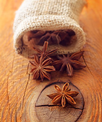 Anise in the sack on the wooden board
