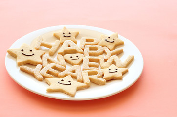 Happy new year homemade cookies on pink background