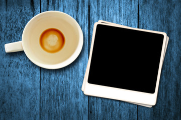 Old movies and a coffee cup on a blue ground.