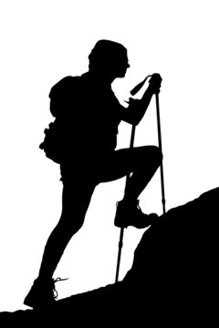 A silhouette of a female climbing a cliff