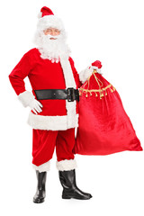 Full length portrait of a Santa Claus holding a bag full of gift
