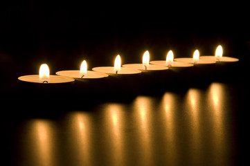 Small candles in dark. Holiday/romance/meditation concept