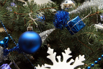 Blue ball and decorations on a Christmas tree