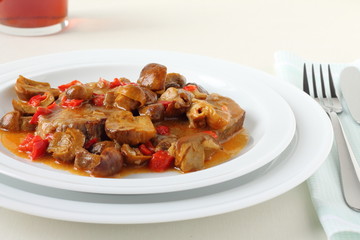Veal with mushrooms, peppers and wine sauce