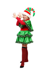 Girl in a dress of the Christmas elf shows teasing