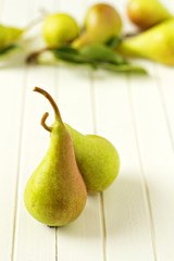 Two ripe pears on wooden table