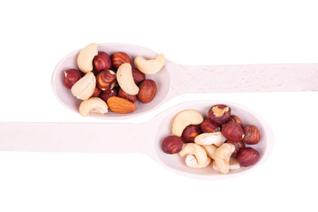 nuts are in a wooden spoon