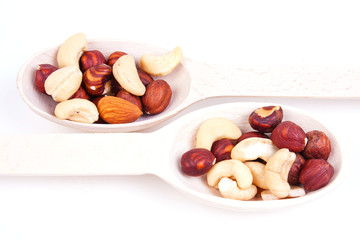 Obraz na płótnie Canvas nuts are in a wooden spoon