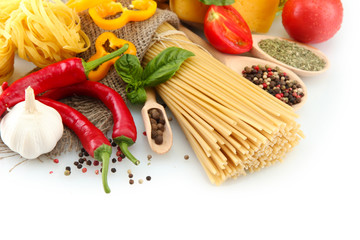 Pasta spaghetti, vegetables and spices, isolated on white