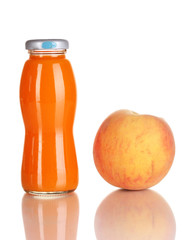 Delicious peach juice in glass bottle and peach next to it