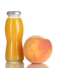 Delicious peach juice in glass bottle and peach next to it