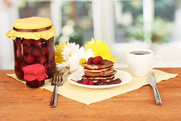 delicious sweet pancakes on bright background
