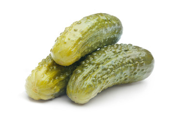 Pickled cucumbers on white background