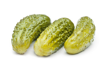 Pickled cucumbers on white background