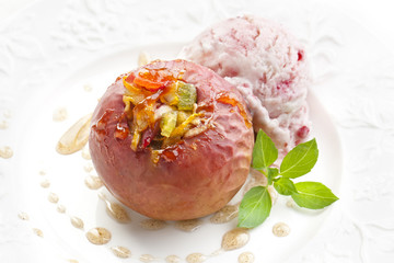 Baked apple with nuts on white