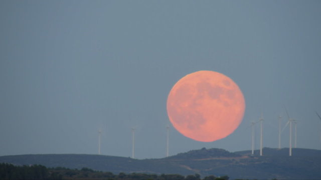 Full moon over windmills