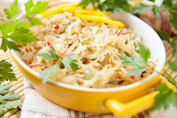 Freshly cooked cabbage in a yellow bowl