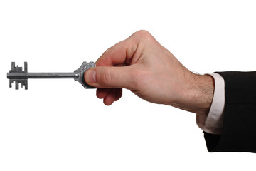 Hand with key isolated over white background