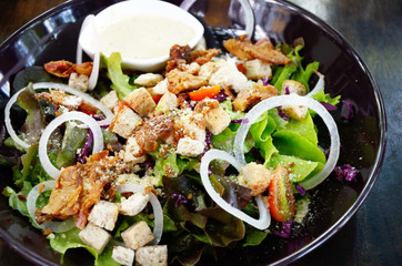 Salad in black dish