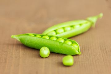 Pod of open green peas