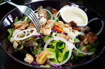 Salad in black dish