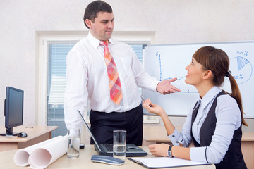 Man and woman working in office