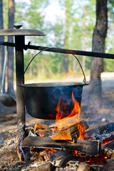 Сauldron over campfire