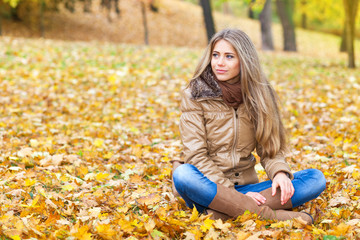 Cute blond woman in autumn
