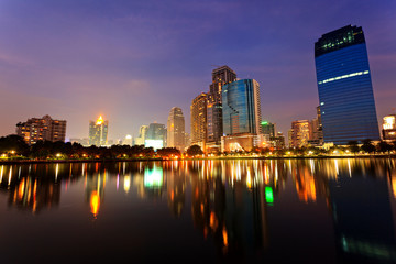 Fototapeta na wymiar Bangkok in evening, reflection of buildings in water