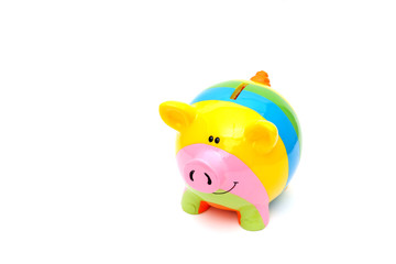 Piggy bank style money box isolated on a white studio background