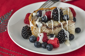 Coffee cake with fresh berries on a Christmas place mat