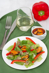 seafood salad with pepper and glass of wine