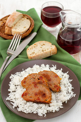 roll of meat with boiled rice on the plate