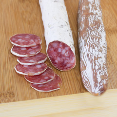 Culinary traditional spanish sausages on wooden background.