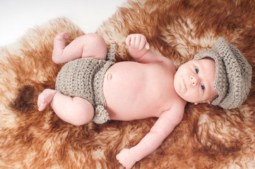 Newborn baby in knitted wear