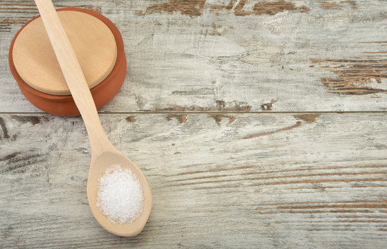 Sea Salt on vintage background with space for texr