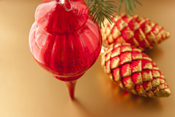 Red Christmas decoration on golden background