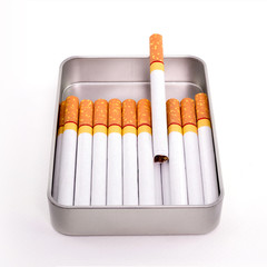 Cigarettes in metal box isolated on white background