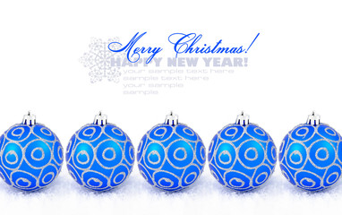 Blue christmas balls with snow isolated on white with space for