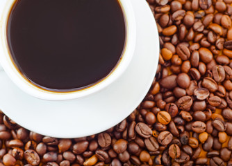 fresh coffee in the white cup, coffee and coffee beans