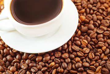 fresh coffee in the white cup, coffee and coffee beans