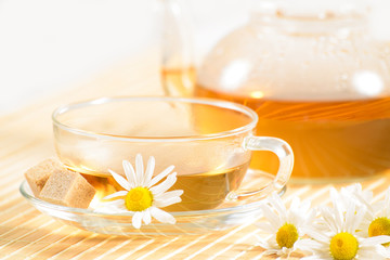 teacup with herbal chamomile tea