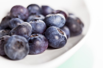 Close up of fresh blueberry on plate.