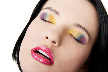 Beautiful woman with rainbow eye make up