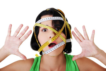 Woman with measuring tape around her head