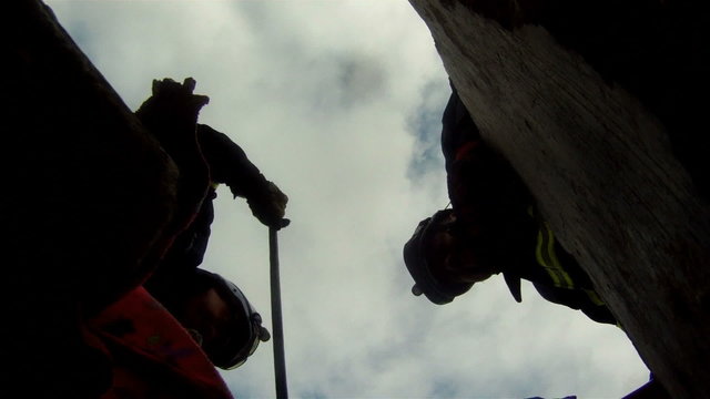 Silhouette of rescue men in buildings collapsed