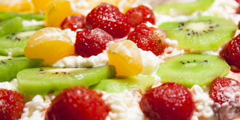 Fototapeta na wymiar Dessert with fresh fruits and whipped cream