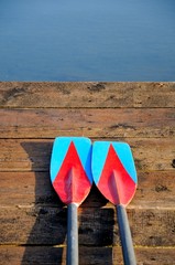 Two oars on wooden