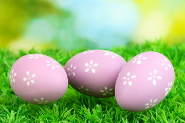 Colorful easter eggs on grass